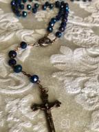 картинка 1 прикреплена к отзыву Винтажное религиозное ожерелье Назаретского магазина с глубокими синими хрустальными бусинами, католическим молитвенным подвеском, включающим медаль и крест с святой почвой Иерусалима - коллекция древних росариев Святой Земли. от Eric Amiradaki