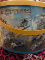 картинка 1 прикреплена к отзыву Конструктор городского полицейского участка с машинами полиции, полицейским вертолетом, фургоном тюрьмы, увлекательной игрушкой полиции для детей, лучший подарок в конструкционных науках для мальчиков от 6 до 12 лет (808 деталей) от Aavon Dark