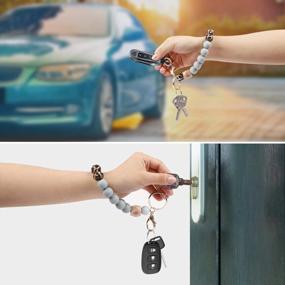 img 1 attached to Силиконовый вышитый бисером браслет-брелок с нашивкой для портативного телефона, ключей от дома и автомобиля