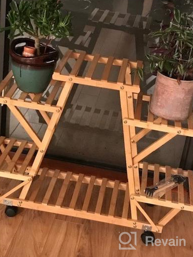 img 1 attached to Bamboo 6 Tier Rolling Plant Stand - Stylish Indoor/Outdoor Planter Display Rack For Your Patio Or Living Room review by Malik Berry