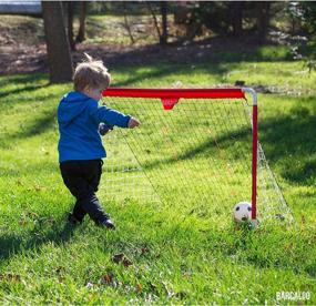 img 2 attached to 3-In-1 Sports Net With Soccer, Pitchback, Hockey: Includes Balls, Puck, And Sticks For Ultimate Versatility