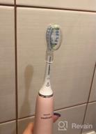img 2 attached to Philips Sonicare DiamondClean 9000 HX9911 sonic toothbrush, pink review by Ha Joon