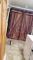 img 1 attached to Add Vintage Charm To Your Bathroom Décor With NYMB Old Barn Door Shower Curtain - Rustic American Style Waterproof Bathroom Accessories With 12 Hooks review by Melissa Mack