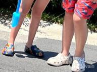 img 1 attached to 👞 Crocs Unisex Classic Graphic Multi Boys' Clogs & Mules: Stylish and Comfy Footwear review by Emmanuel Pictorial
