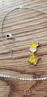 img 1 attached to Giraffe Necklace Charm Inspirational Gifts review by Travion Matias