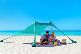 img 1 attached to AMMSUN Beach Tent With Sandbag Anchors, Portable Canopy Sun Shelter UV Protection 7Ft X 7Ft Lightweight 100% Lycra Family Sunshade For The Beach Camping & Outdoor (Blue/Green)
