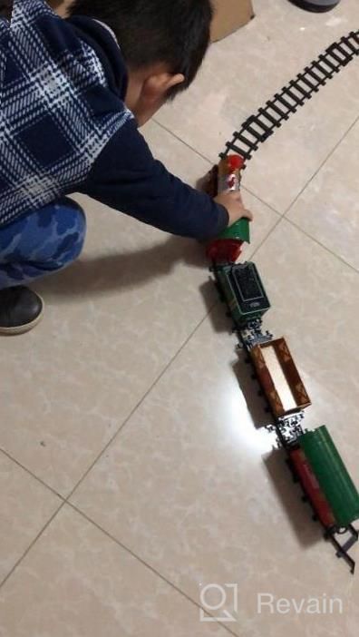 img 1 attached to Experience The Magic Of The Holidays With PUSITI Classic Christmas Train Set - Battery Operated Locomotive Engine And 11.5 Ft Tracks With Lights And Sounds For Kids' Delight review by William Mahajan