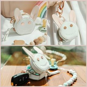 img 3 attached to 🐰 MOMINSIDE Pacifier Case Holder with Clip: Adorable Rabbit Bag Charm to Safely Carry & Easily Attach 2 Pacifiers in White