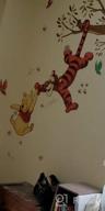 img 1 attached to Sweeten Your Walls With RoomMates Winnie The Pooh Swinging For Honey Wall Decals! review by Dennis Wood
