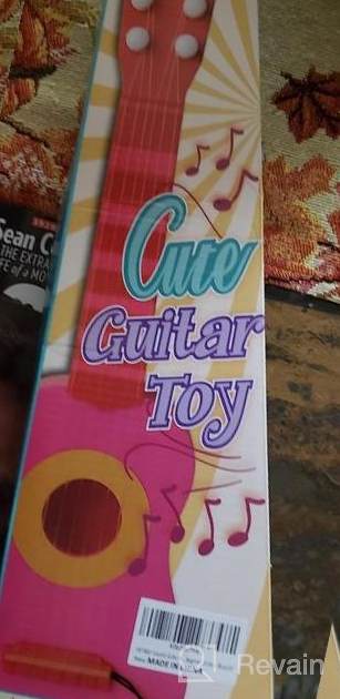 img 1 attached to Cute And Educational: Introducing The WEY&FLY Kids Toy Guitar With 6 Strings For Developing Baby Rhyme And Musical Skills review by Sam Bell