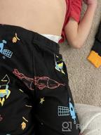 img 1 attached to 🦖 Dinosaur Skeleton Christmas Sleepwear for Boys - Festive Children's Clothing review by Derrick Shah