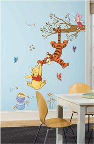 img 3 attached to Sweeten Your Walls With RoomMates Winnie The Pooh Swinging For Honey Wall Decals!