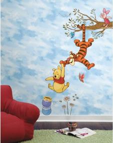 img 4 attached to Sweeten Your Walls With RoomMates Winnie The Pooh Swinging For Honey Wall Decals!