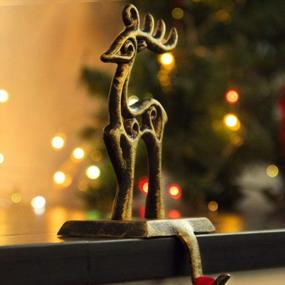 img 1 attached to Add A Touch Of Vintage Charm To Your Fireplace With ODOMY Christmas Stocking Holders: Choose Your Metal Deer Holder Now!