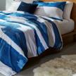 rivet modern shibori watercolor stripe bedding set - indigo, full/queen logo