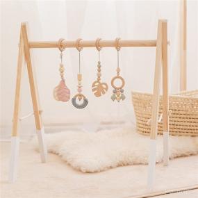 img 4 attached to 🌳 Wood Baby Gym with Foldable Frame and 4 Pendant Toys: Perfect Newborn Gift for Baby Girls and Boys