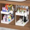 maximize your storage space: soyo 2 pack under sink organizers for kitchen and bathroom - versatile, multi-tier shelf with hanging cups, hooks, dividers, and countertop caddy in white logo