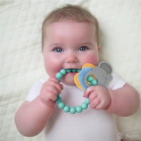 img 4 attached to Nuby Chewy Charms Key Silicone Teether: A Soothing Solution for Teething Babies