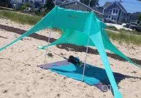 img 5 attached to AMMSUN Beach Tent With Sandbag Anchors, Portable Canopy Sun Shelter UV Protection 7Ft X 7Ft Lightweight 100% Lycra Family Sunshade For The Beach Camping & Outdoor (Blue/Green)