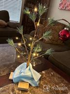 картинка 1 прикреплена к отзыву Bring The Classic Spirit Of Charlie Brown'S Christmas To Your Home With ProductWorks' 24" Tree And Linus'S Blanket Decoration от Roger Weinmunson