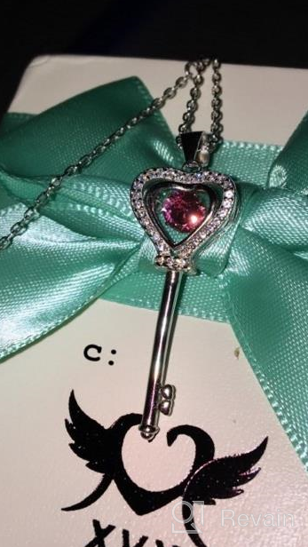 img 1 attached to 💖 XVX Beating Heart Key Necklace in 925 Sterling Silver with White Gold Plating, studded with Cubic Zirconia Dancing Birthstone Pendant, Perfect Forever Love Jewelry Gift for Women and Girls review by Solomon Inks