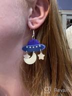 img 1 attached to 👽 Cute UFO Dangle Earrings: Trendy Novelty for Women & Girls - Acrylic Flying Saucer UFO Moon and Star Designs review by Olga Allen