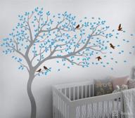 enhance your space with a stunning tree wall decal: large forest mural, blowing in the wind, perfect for nurseries (leaning right, grey, ice blue, brown) логотип