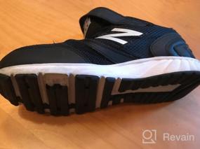 img 7 attached to Новинка: Черные беговые детские кроссовки New Balance: Раскройте потенциал вашей маленькой спортсменки!