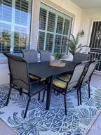 img 1 attached to All-Weather Outdoor Dining Set: 7-Piece Patio Table And Chairs Set For 6-8 With Swivel Dining Chairs And Expandable Table By PHI VILLA review by Lauralee Sabelman