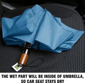 img 1 attached to Компактный ветрозащитный дорожный зонт с голубым перевернутым дизайном, идеально подходящий для пеших прогулок: прочная деревянная ручка, функциональность наизнанку и защита рюкзака от дождя.