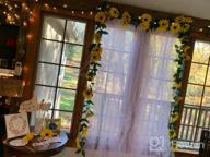 картинка 1 прикреплена к отзыву 2-Pack Artificial Sunflower Garland Vine with Silk Sunflowers and Green Leaves - Ideal for Wedding Table Décor от Jason Clemons