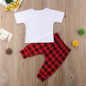 img 1 attached to Adorable Christmas Outfit Set For Toddler Girls: Short-Sleeve Santa T-Shirt With Plaid Pants