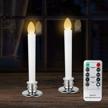 flickering flameless window candles with remote & timers - set of 2 silver electric taper candles with candle holders logo