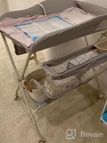 img 7 attached to Портативный складной пеленальный столик для младенцев с регулируемой высотой, ремнем безопасности, стеллажом для сушки и хранения, мобильной подставкой-органайзером на колесах для новорожденных - розовый