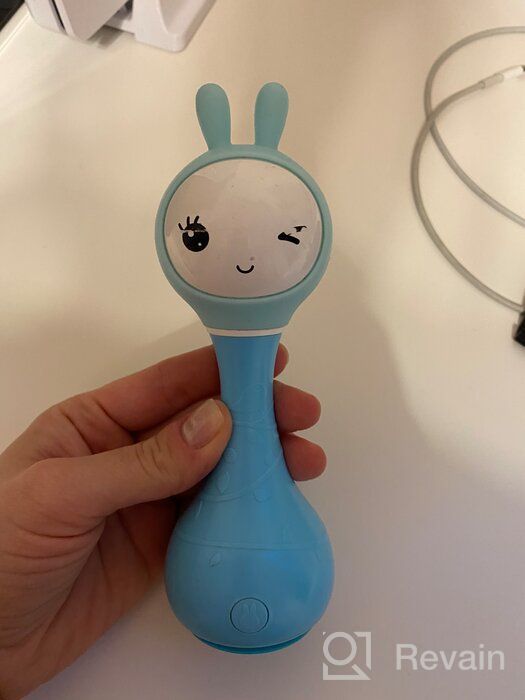 img 1 attached to 🎶 Blue Alilo Smarty Bunny Shake & Tell Musical Toy Rattle for Newborns and Infants - Soother with Lullaby Song Story, Music Player & Games review by Riko Long ᠌