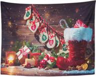 rustic christmas wall tapestry with pockets, 50"x60" emvency home decor featuring vintage wooden candy gifts, snowflakes, and happy xmas for bedroom, living room or dorm - ideal for holiday season logo