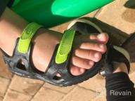 картинка 1 прикреплена к отзыву Crocs Swiftwater River Sandal Sandal: Детский унисекс, черный/зеленый (тон напряжения), размер 10 M - удобный и стильный выбор для маленьких ножек от Jeff Hall