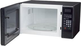 img 1 attached to 🔥 Convenient and Stylish Magic Chef Black 1.1 Cu. Ft. 1000W Countertop Microwave Oven with Push-Button Door - Fast Heating and Easy Access