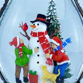 img 1 attached to Christmas Musical Snow Globe Lantern with Lighted Snowman Family, Water Glittering Swirling - 6H Timer, 8 Christmas Songs, USB or AAA Battery Operated - Ideal for Christmas Home Decoration