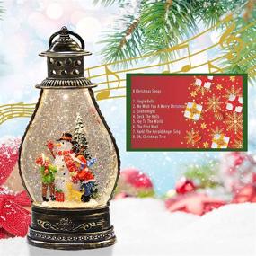 img 3 attached to Christmas Musical Snow Globe Lantern with Lighted Snowman Family, Water Glittering Swirling - 6H Timer, 8 Christmas Songs, USB or AAA Battery Operated - Ideal for Christmas Home Decoration