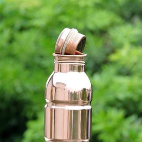 img 2 attached to HealthGoodsIn - Ayurvedic Pure Copper Water Bottle, 1000ml 🍶 (33.8 US Fluid Ounce), Seamless Design, Leakproof and Joint Free