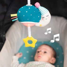 img 1 attached to 🌙 Таф Тойз Музыкальная мини-луна, портативная подвесная игрушка для младенцев с музыкой и светом, путешественник для родителей и малышей, успокаивает и расслабляет ребенка во время прогулок, подходит для новорожденных и старше