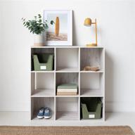 stylish whitewash 9 cube storage organizer or bookcase by signature design - ashley paxberry collection logo