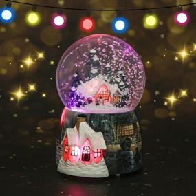 img 2 attached to 🏼 Enchanting Snow Globes for Boys and Girls: Christmas Village Santa Snow Globe with Magical Glitter, 7 Color Changing Lights, Musical Box, and Castle in the Sky - Ideal Xmas & Birthday Gifts!