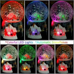 img 3 attached to 🏼 Enchanting Snow Globes for Boys and Girls: Christmas Village Santa Snow Globe with Magical Glitter, 7 Color Changing Lights, Musical Box, and Castle in the Sky - Ideal Xmas & Birthday Gifts!