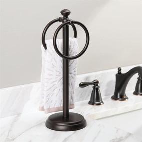 img 2 attached to mDesign Bronze Towel Rack Stand with 2 Hanging Rings for Bathroom Vanity Countertops - Space Saving Hand Towel Holder with Hyde Collection