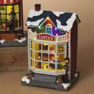 animated lighted christmas village shops storefronts with moving scene - santa's workshop logo