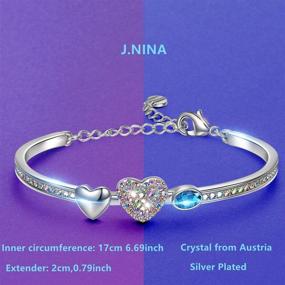 img 3 attached to 💎 J.NINA Women's Charm Bracelet with Crystal Hearts, Four-Leaf Clovers, and Round Cubic Zirconia, includes Luxury Jewelry Box - Perfect Gift for Wife, Daughter on Valentine's Day, Birthday, Mother's Day