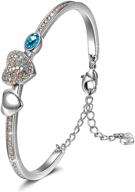 💎 j.nina women's charm bracelet with crystal hearts, four-leaf clovers, and round cubic zirconia, includes luxury jewelry box - perfect gift for wife, daughter on valentine's day, birthday, mother's day logo