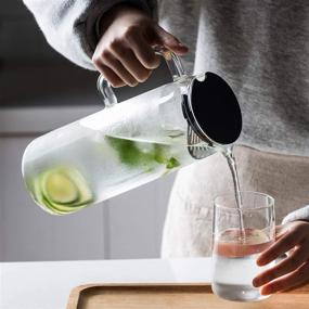 img 2 attached to 🥤 MDZF SWEET HOME 48 Oz Glass Pitcher: Stainless Steel Strainer, Food-Grade Plastic Lid, Perfect for Homemade Juice, Iced Tea, and Cold Water"